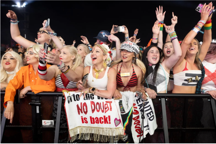 Fans cheering for No Doubt’s performance on the Coachella stage (Photo By: Drew A. Kelley).